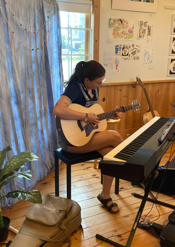 Performer playing guitar